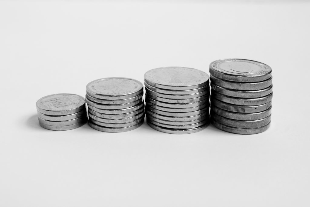 Money_Coin_Stack_On_White_Background_original_1746958-1024x683